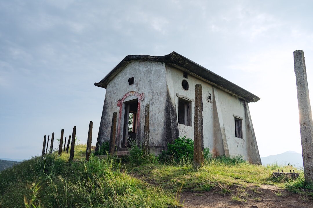 old house on hill at dusk